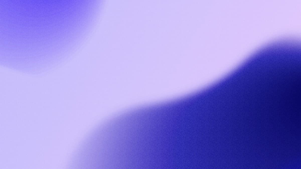A soft lavender and indigo gradient with a gentle grain texture